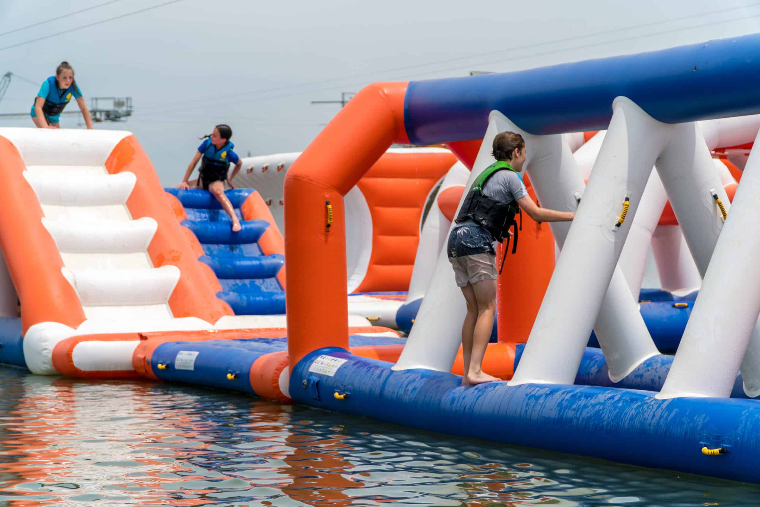 kids going through obstacles on aqua park